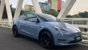 Light Blue Tesla Model Y on the bridge