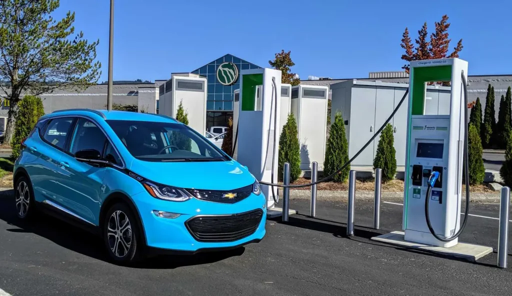 Chevy Bolt receiving a quick charge at a Level 3 DC fast charging station.