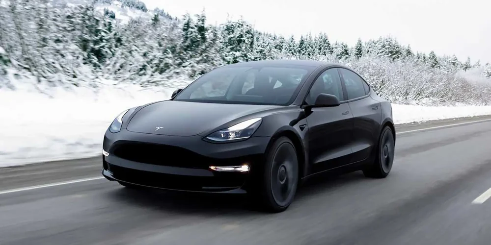 Tesla drive on road in Winter